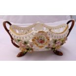 Capodimonte oval two handled pierced fruit bowl with applied flowers and leaves all on four stylised