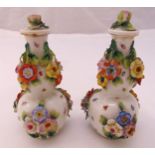 Sitzendorf a pair of 19th century porcelain double gourd bocage vases with detachable covers,