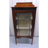 An Edwardian rectangular glazed mahogany display cabinet with satinwood inlays on four tapering