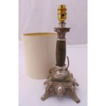 A silver plate and faux marble table lamp of Corinthian column form on raised scroll pierced