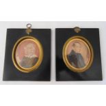 A pair of 19th century hand painted miniatures of a gentleman and a lady, 15 x 13cm