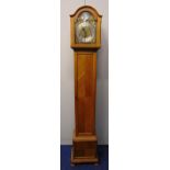 An oak cased grandmother clock the silvered dial with Roman numerals, two train movement, the