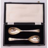 A cased set of hallmarked silver salad servers, reed and tie borders, Sheffield 1947, approx total