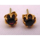 A pair of 9ct gold and garnet earrings