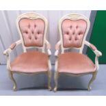 A pair of French style upholstered armchairs on cabriole legs