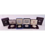 Four silver proof coins in fitted cases to include American Eagles