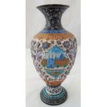 A Persian enamel and white metal baluster vase decorated with scenes of landscapes and mosques,