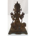 A Chinese metal alloy figurine of a Buddha seated on a lion on raised rectangular base, 30cm (h)