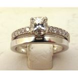 Tiffany & Co. platinum and diamond engagement ring and matching wedding band, approx total weight
