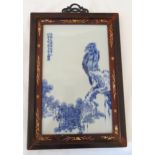 A Chinese Republic period rectangular blue and white porcelain plaque decorated with a bird and