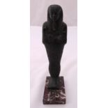 An early 20th century cast bronze figurine of an Egyptian mummy on raised rectangular marble plinth,