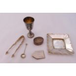 A quantity of hallmarked silver to include a Kiddush cup, a pill box, a money clip and a