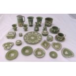 A quantity of green Wedgwood Jasperware to include vases, a table bell, cups, saucers and a