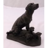 A composition bronzed figurine of a Labrador with three puppies on raised naturalistic base, 15.