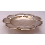 A Mappin and Webb hallmarked silver fruit dish, shaped circular with moulded border on circular