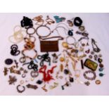 A quantity of costume jewellery to include necklaces, brooches, rings and bracelets