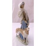 Lladro figurine of a lady with a dog, marks to the base, 37.5cm (h)