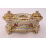 A Victorian porcelain double inkwell rounded rectangular, the two wells with detachable covers,