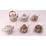 Six miniature oriental teapots of various form and shape