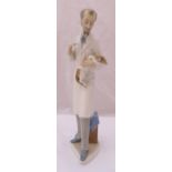 Lladro figurine of a Vet holding a dog, marks to the base, 33.5cm (h)