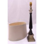 An early 20th century tapering cylindrical panelled enamel and pewter table lamp to include a shade,