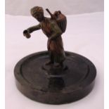 A cold painted Austrian bronze figurine of a Middle Eastern gentleman selling his wares, on raised