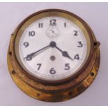 A brass mounted ships clock, silvered dial, subsidiary seconds dial and Arabic numerals, 16cm (dia)
