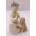 Lladro figurine of a boy with a dog, marks to the base, 18.5cm (h)