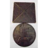 A bronze WWI memorial death plaque attributed to Harry Levy in original folding envelope