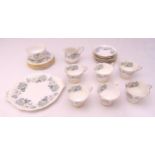 Royal Albert Silver Maple teaset to include cups, saucers, plates, a cake plate, a milk jug and a