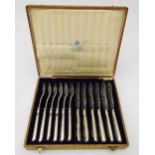 A cased set of hallmarked Russian silver fish eaters, the engraved blades with fish and scrolls,