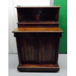 A Victorian rectangular mahogany chiffonier with two glazed cupboards above three drawers all on a