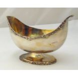 A Victorian hallmarked silver oval bowl with applied shell and scroll borders on raised oval base