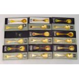 Georg Jensen nine silver gilt hallmarked year spoons in original fitted cases from 1973 to 1981
