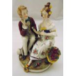 A Vienna figural group of a lady and gentleman in 19th century dress, marks to the base, 18cm (h)