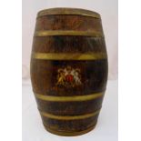 An oak barrel umbrella stand, brass bound with painted coat of arms to the front, 59cm (h)