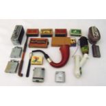 A quantity of smoking collectables to include table and pocket lighters, pipes and match boxes (18)