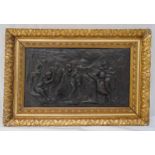 A bronze relief of putti with a goat within an ornate leaf chased gilt frame, frame 49.5 x 74.5cm,