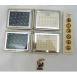 A quantity of Guinness memorabilia to include two perpetual calendars, a set of buttons and a