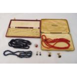 A quantity of costume jewellery to include coral necklace and bracelet, pearls, cufflinks and