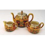 Victorian Imari three piece porcelain tea set with hallmarked silver borders, hallmarks for Henry