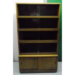 Simplex sectional rectangular bookcase with four glazed shelves above a base double door cupboard,