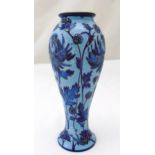 Moorcroft blue on blue baluster base Connoisseur collection flowers and leaves, marks to the base,