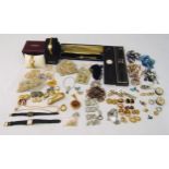 A quantity of costume jewellery to include necklaces, earrings, rings, brooches and wristwatches