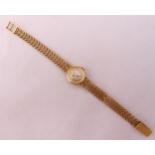 9ct gold ladies wristwatch on articulated bracelet, approx total weight 20.1g