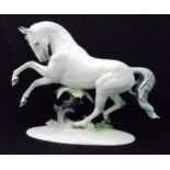 Rosenthal Rampant Horse figurine, dapple grey stallion jumping a tree stump, designed by Professor