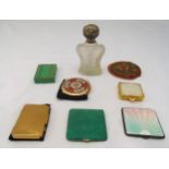 Seven compacts of various form and shape, a cut glass perfume bottle with silver cover and a