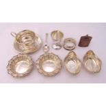 A quantity of hallmarked silver and white metal to include bonbon dishes, an egg cup and a napkin
