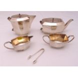 A hallmarked silver four piece tea and coffee set, elongated octagonal form with flush hinged covers