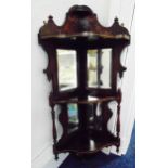 A late Victorian corner wall hanging Whatnot with mirrored panels and turned wooden side columns,